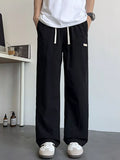 Men's Loose Fit Drawstring Casual Pants by Trendsi