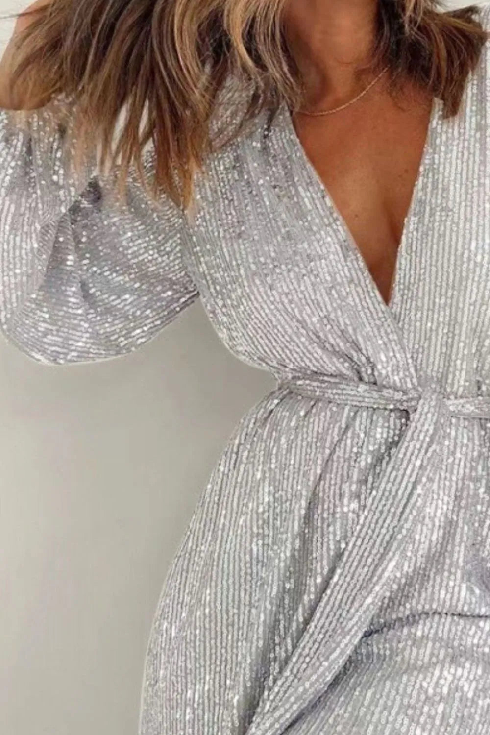 Full Size Sequin Surplice Tie Waist Long Sleeve Romper by Trendsi