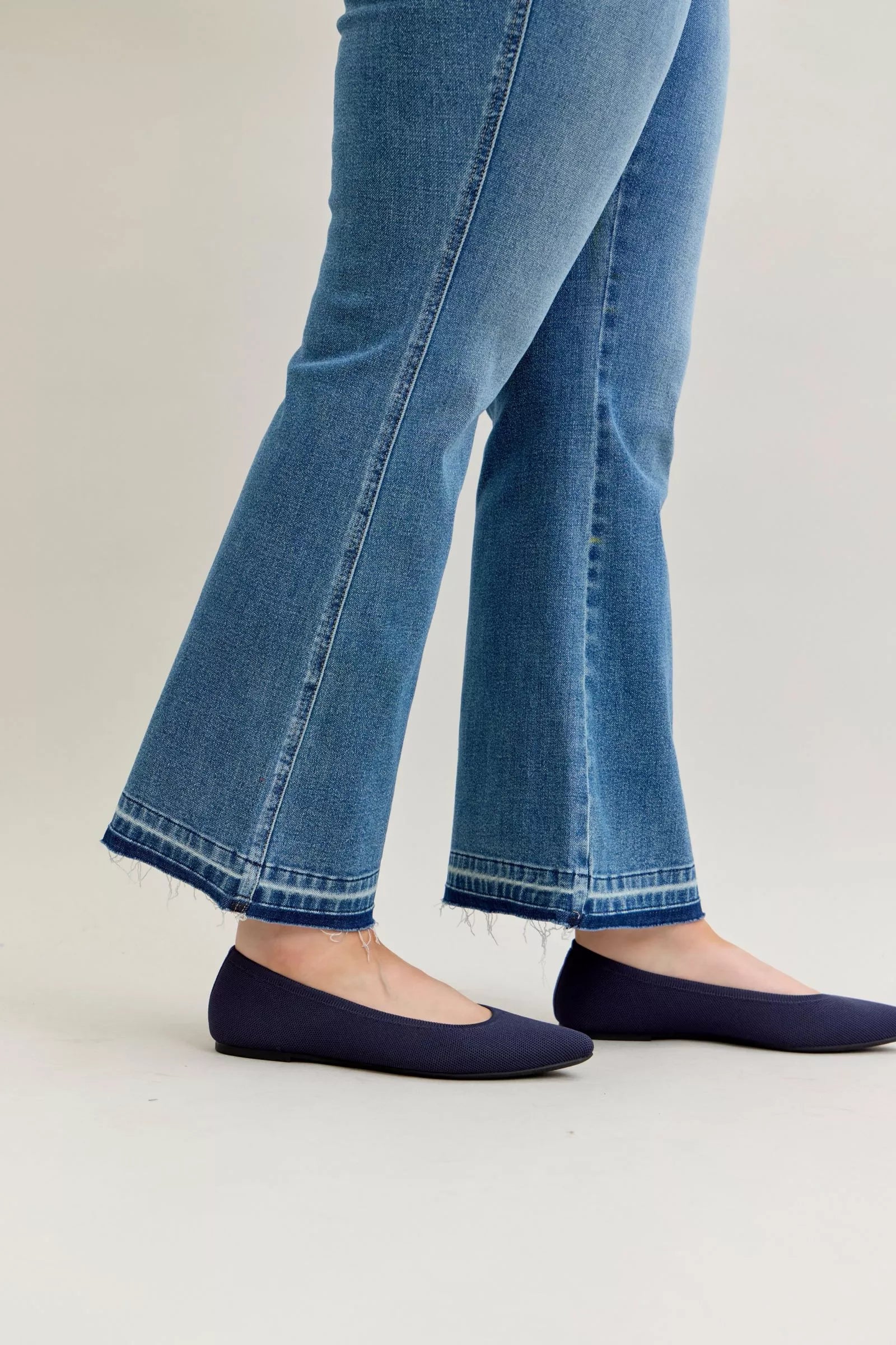 Judy Blue Full Size Mid Rise Slim Bootcut Tummy Control Release Hem Jeans Plus Size by Trendsi