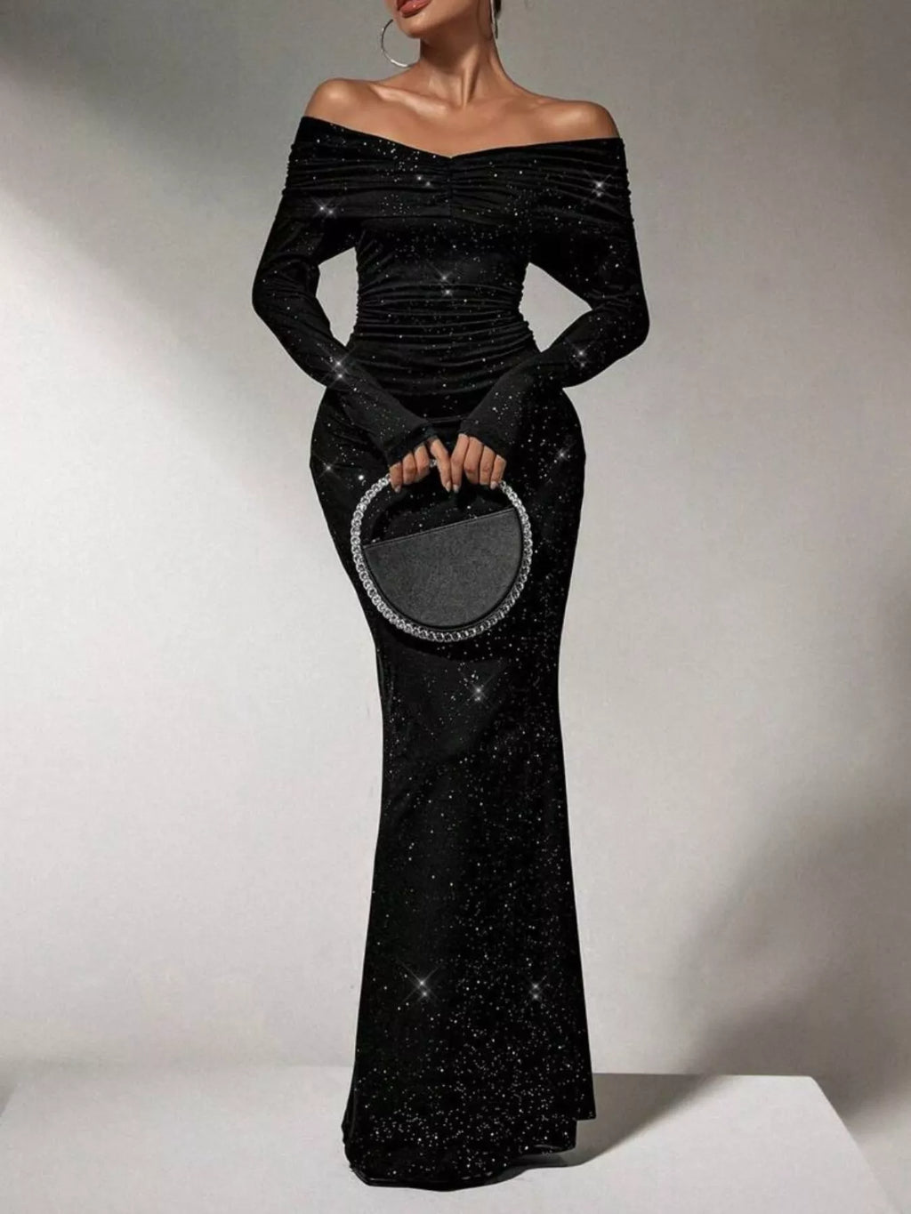 Off-Shoulder Glitter Evening Maxi Dress by Trendsi