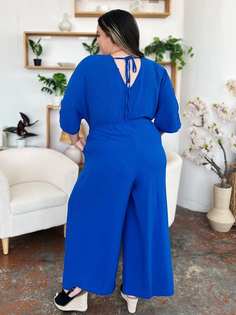 Double Take Full Size Surplice Wide Leg Jumpsuit with Pockets by Trendsi