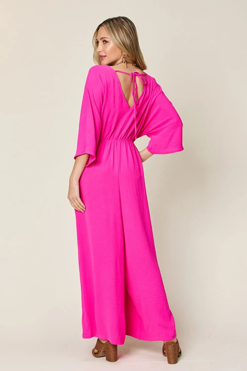 Double Take Full Size Surplice Wide Leg Jumpsuit with Pockets by Trendsi