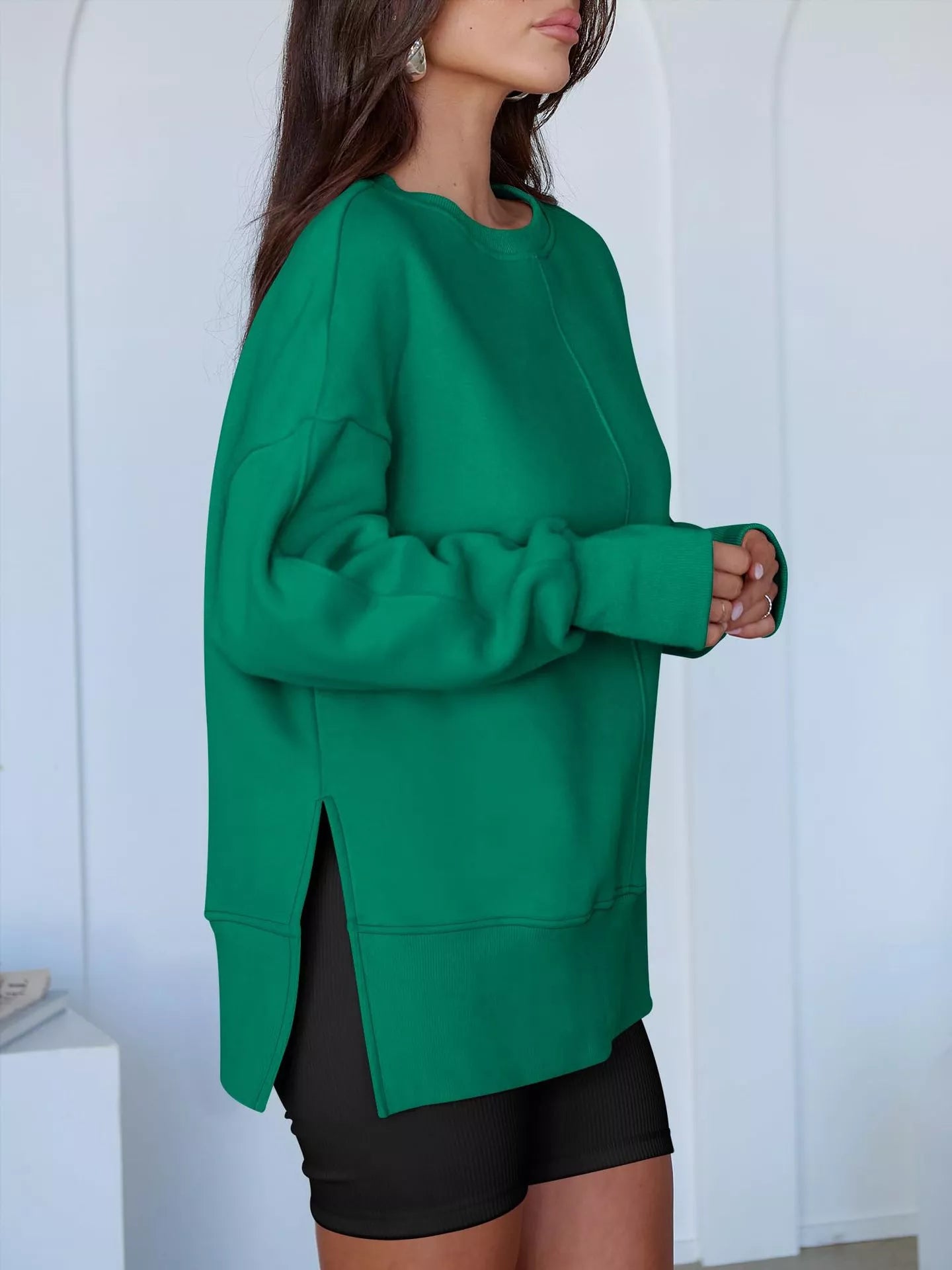 Side Slit Round Neck Long Sleeve Sweatshirt by Trendsi