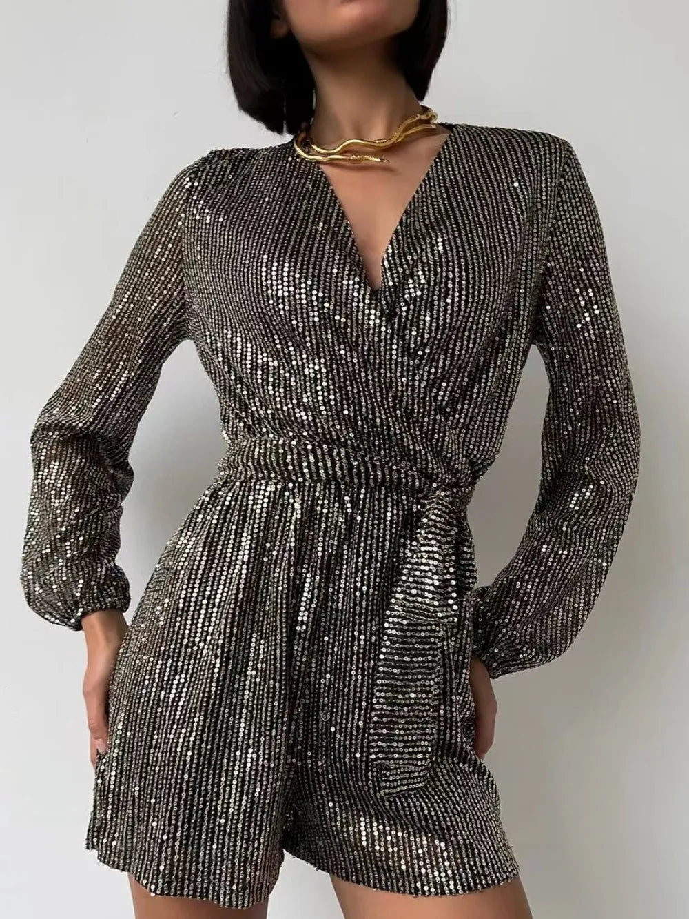 Full Size Sequin Surplice Tie Waist Long Sleeve Romper by Trendsi