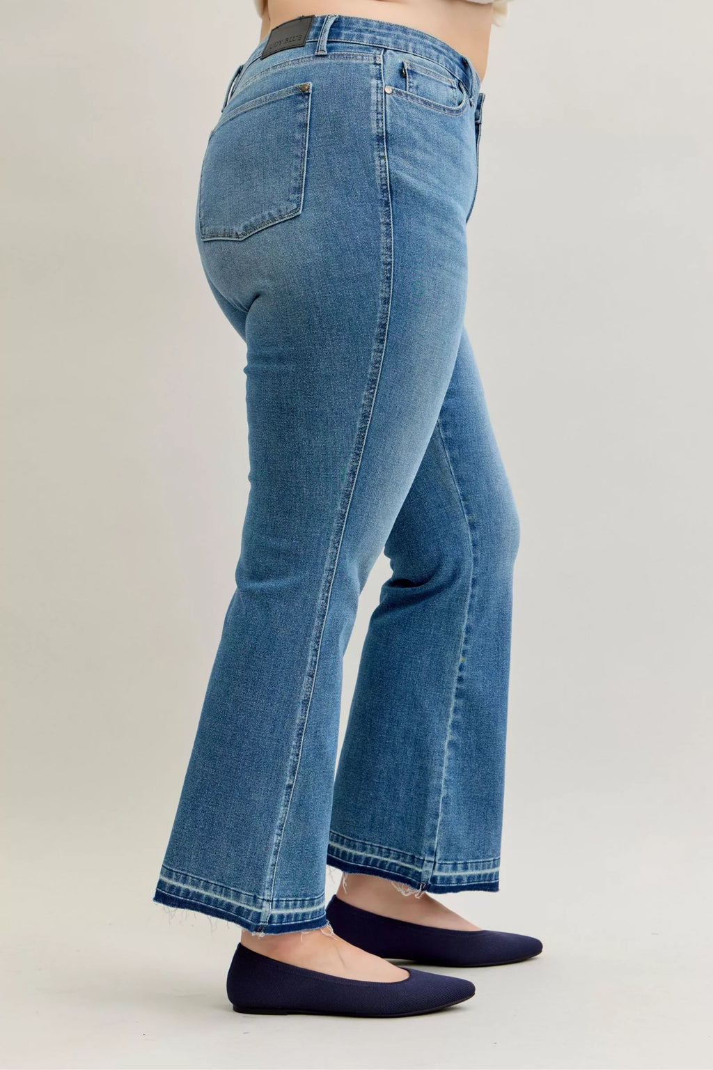Judy Blue Full Size Mid Rise Slim Bootcut Tummy Control Release Hem Jeans Plus Size by Trendsi