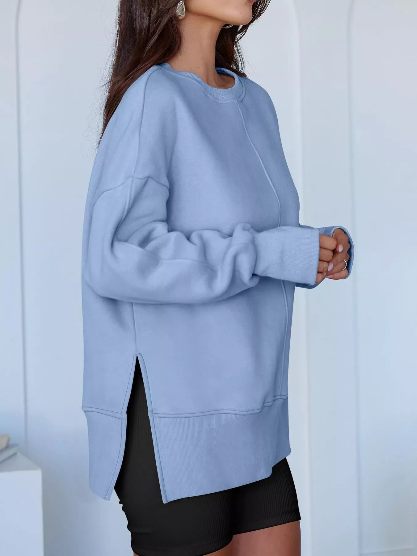 Side Slit Round Neck Long Sleeve Sweatshirt by Trendsi
