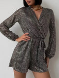 Full Size Sequin Surplice Tie Waist Long Sleeve Romper by Trendsi