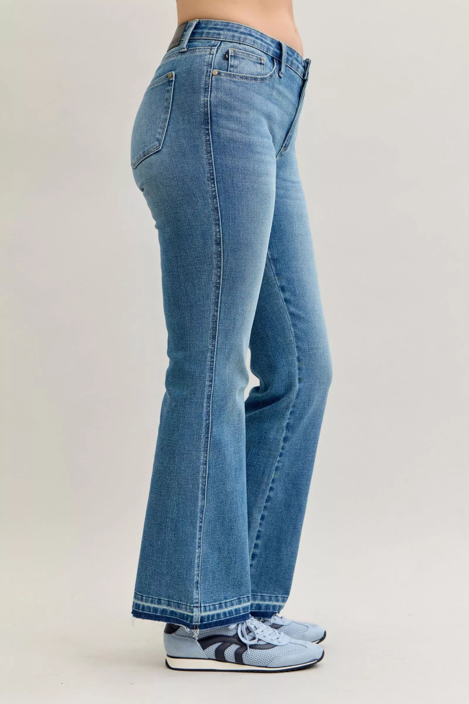 Judy Blue Full Size Mid Rise Slim Bootcut Tummy Control Release Hem Jeans Plus Size by Trendsi