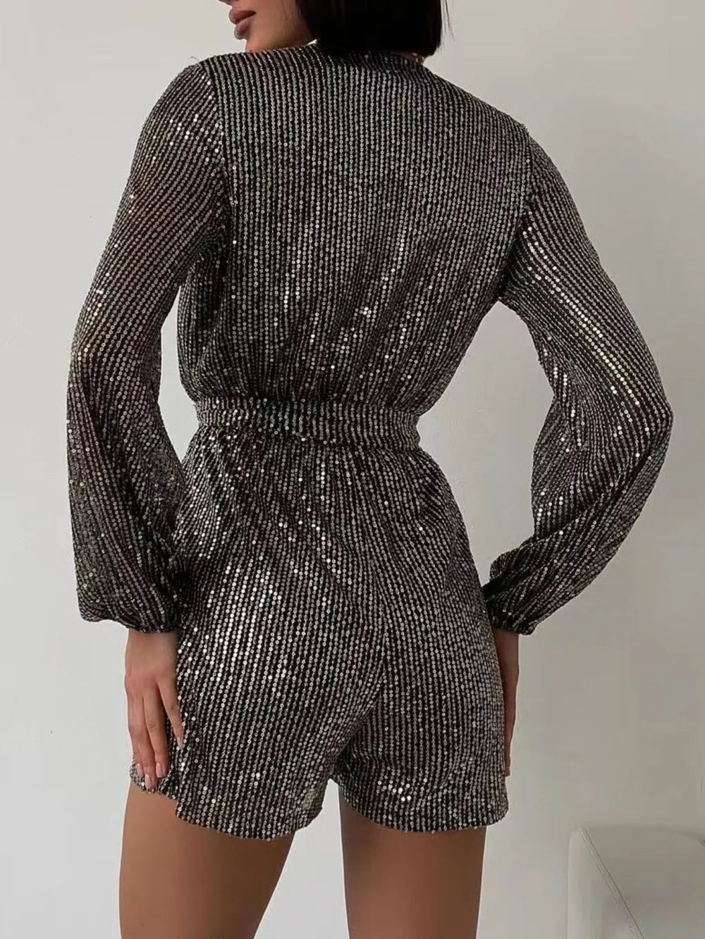 Full Size Sequin Surplice Tie Waist Long Sleeve Romper by Trendsi