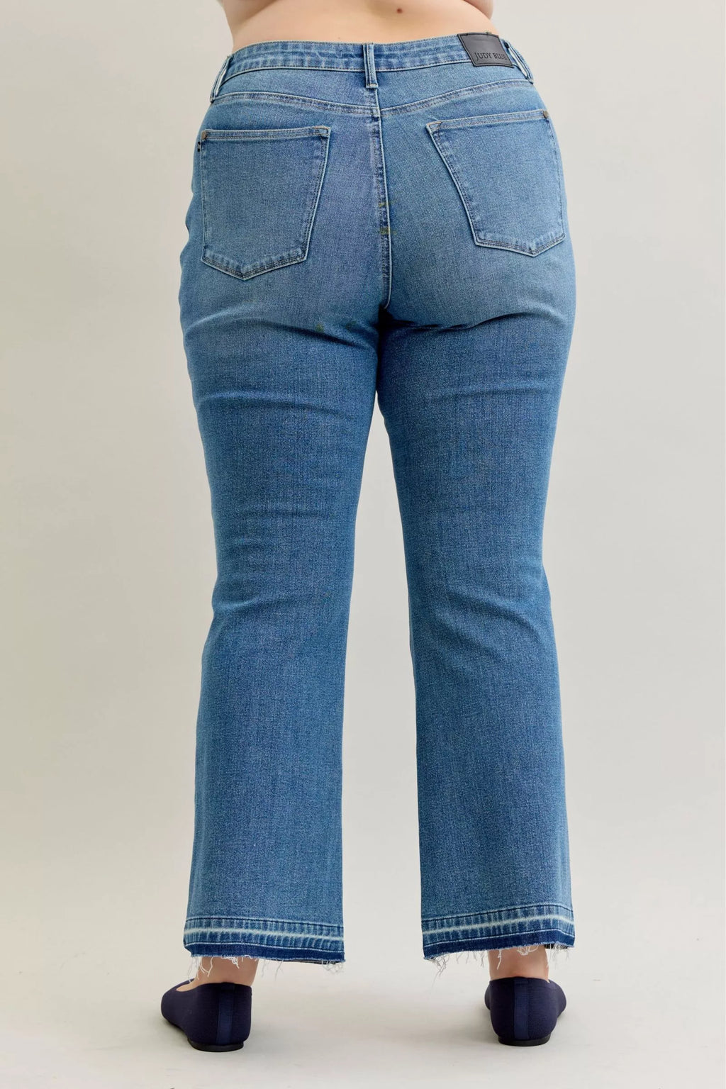 Judy Blue Full Size Mid Rise Slim Bootcut Tummy Control Release Hem Jeans Plus Size by Trendsi