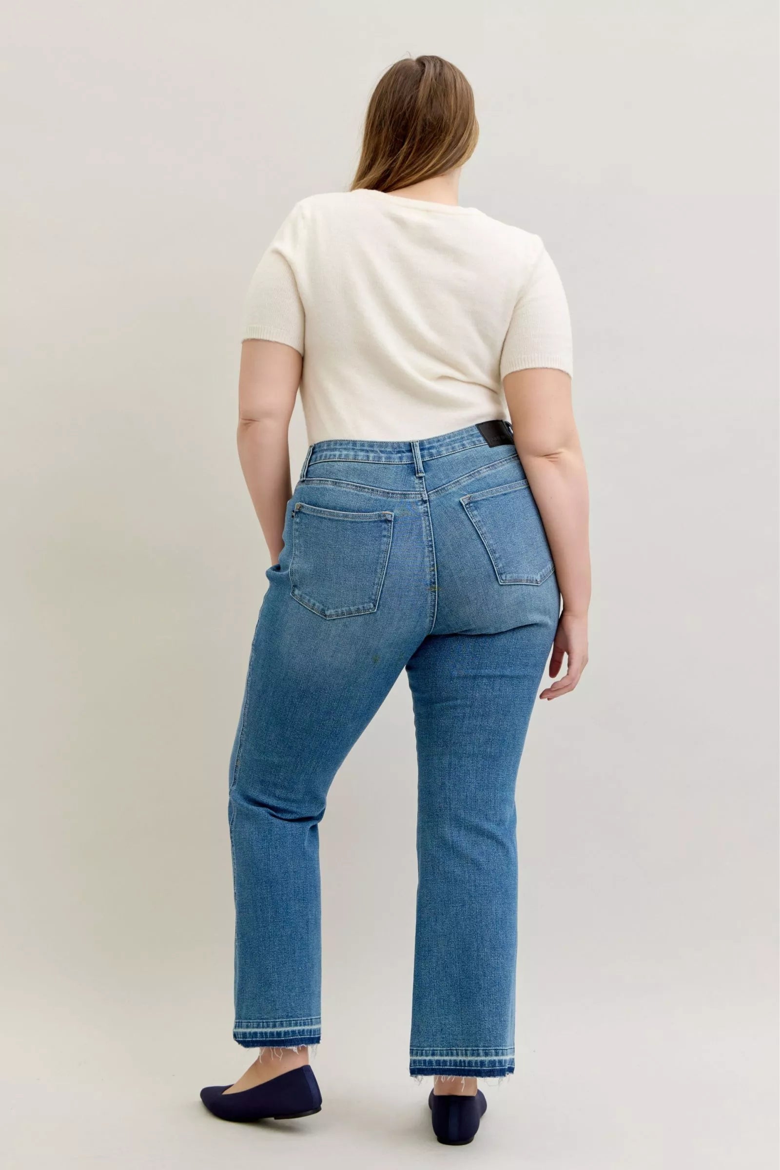 Judy Blue Full Size Mid Rise Slim Bootcut Tummy Control Release Hem Jeans Plus Size by Trendsi
