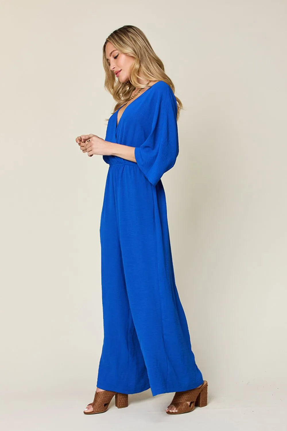 Double Take Full Size Surplice Wide Leg Jumpsuit with Pockets by Trendsi