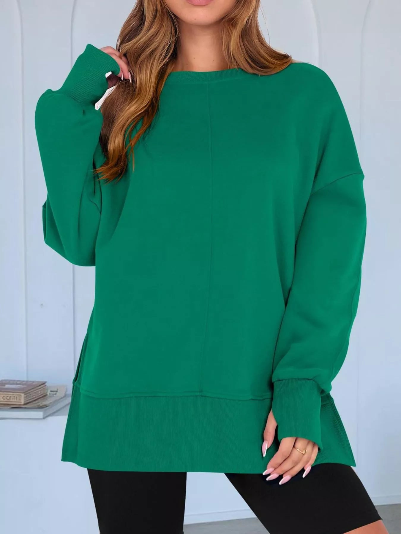 Side Slit Round Neck Long Sleeve Sweatshirt by Trendsi