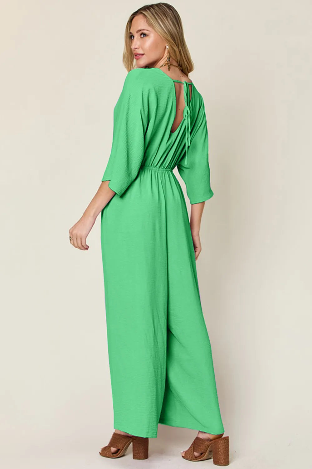 Double Take Full Size Surplice Wide Leg Jumpsuit with Pockets by Trendsi