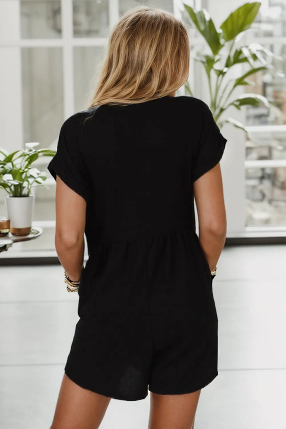 Pocketed V-Neck Short Sleeve Romper by Trendsi