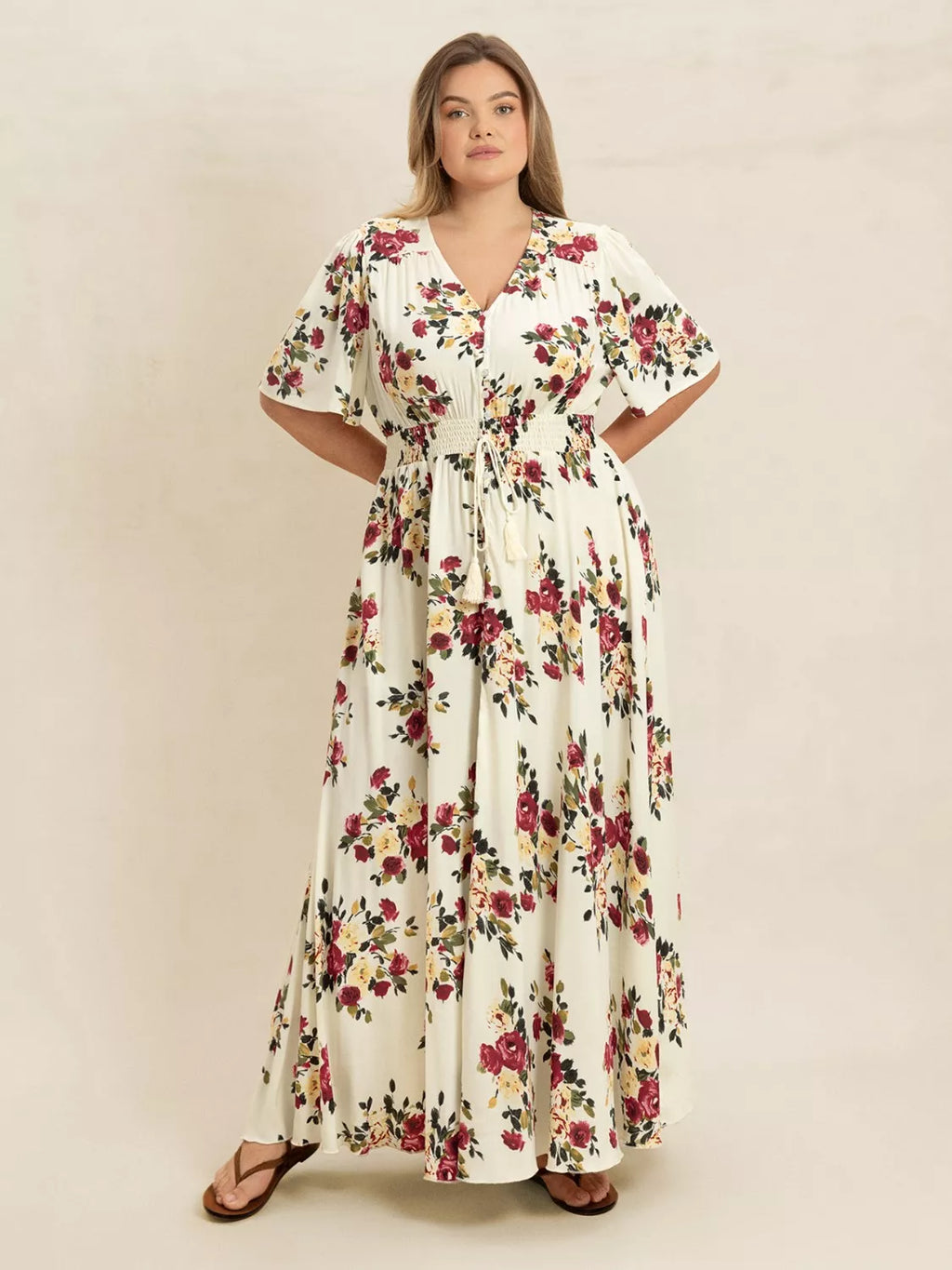 Plus Size Floral Flutter Sleeve Maxi Dress with Button Front by Trendsi