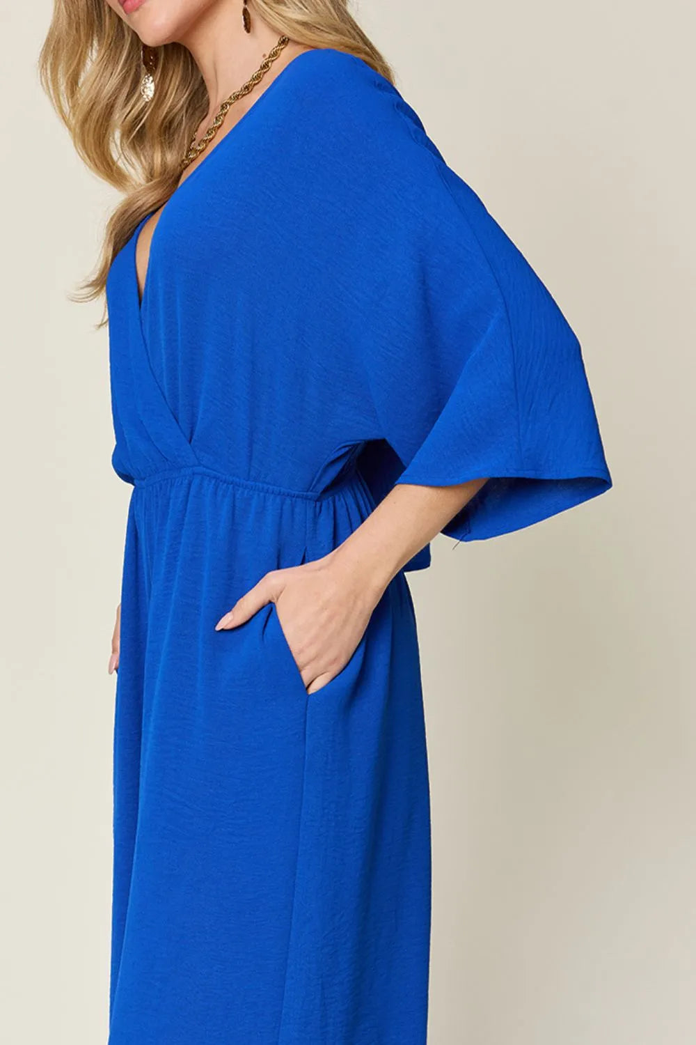 Double Take Full Size Surplice Wide Leg Jumpsuit with Pockets by Trendsi