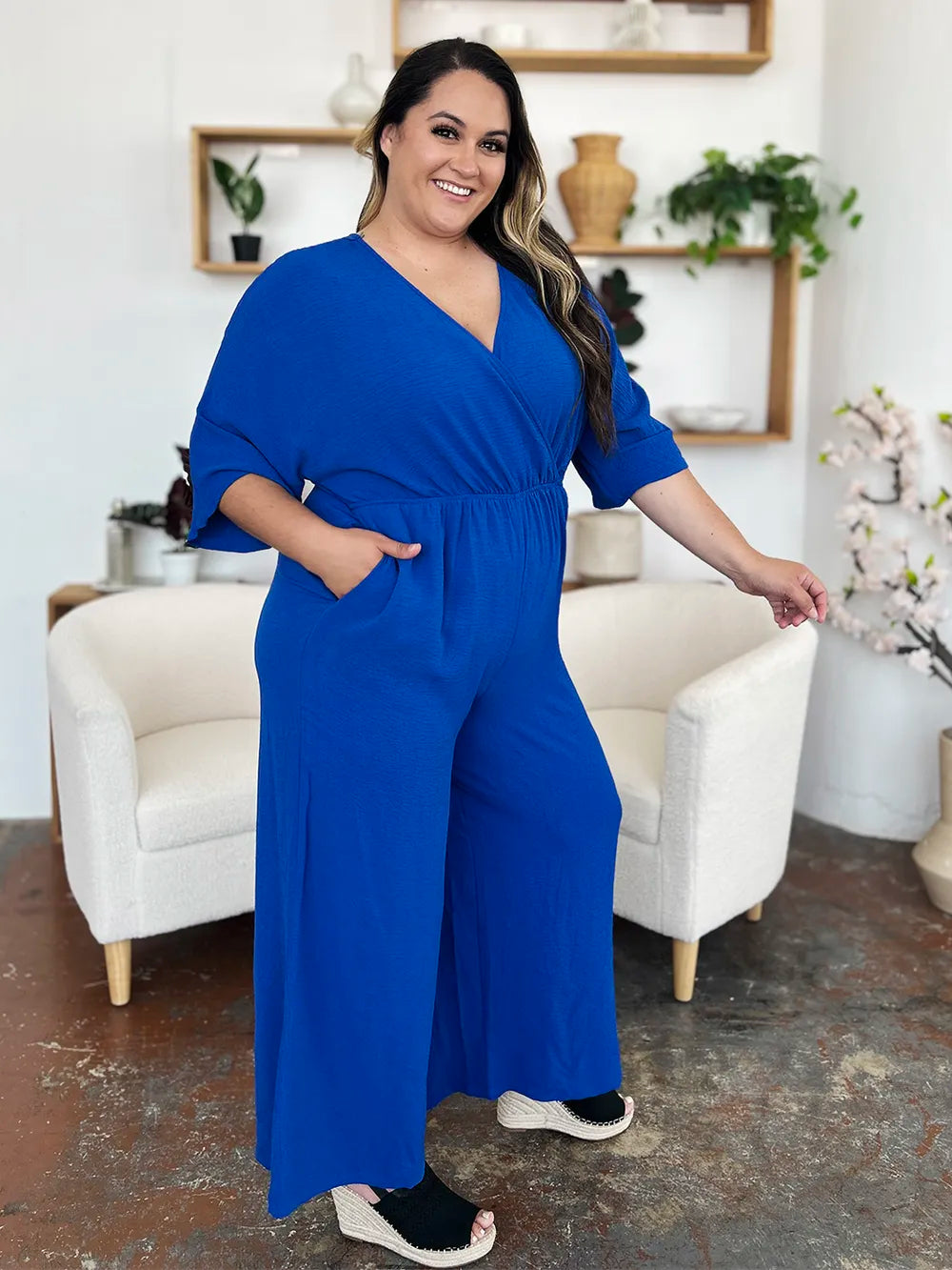 Double Take Full Size Surplice Wide Leg Jumpsuit with Pockets by Trendsi