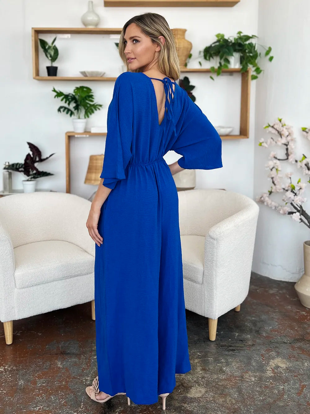 Double Take Full Size Surplice Wide Leg Jumpsuit with Pockets by Trendsi